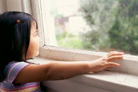 child touching window sill lead paint