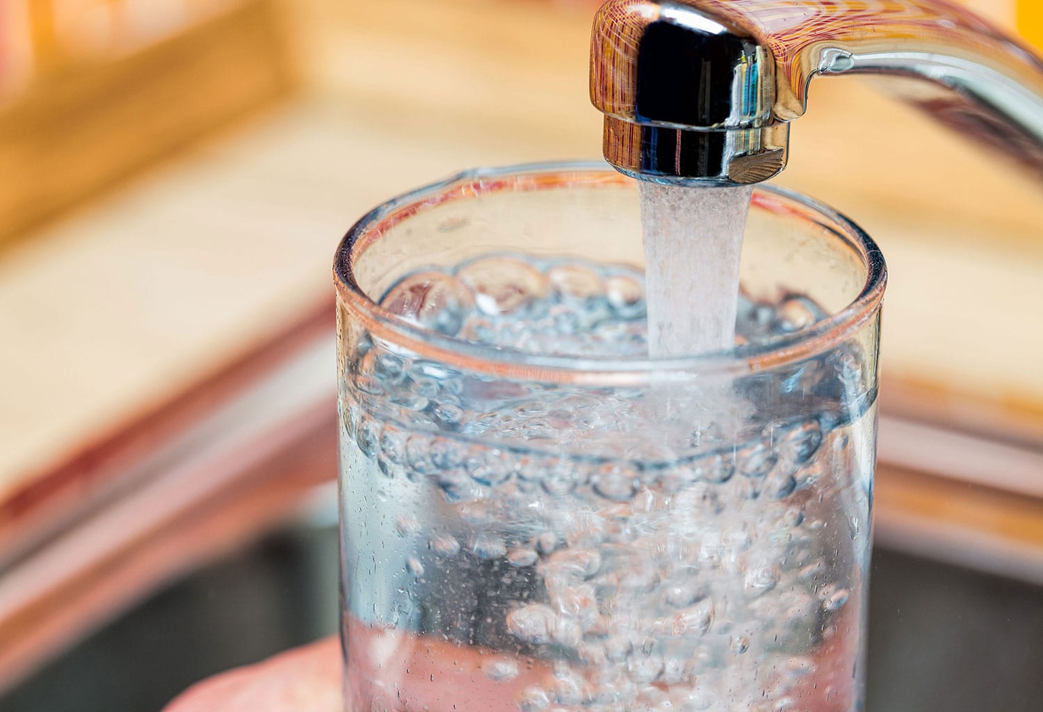 filling a glass with water
